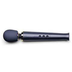 Le Wand Petite Rechargeable Massager in navy blue with gold collar accent, angled side view