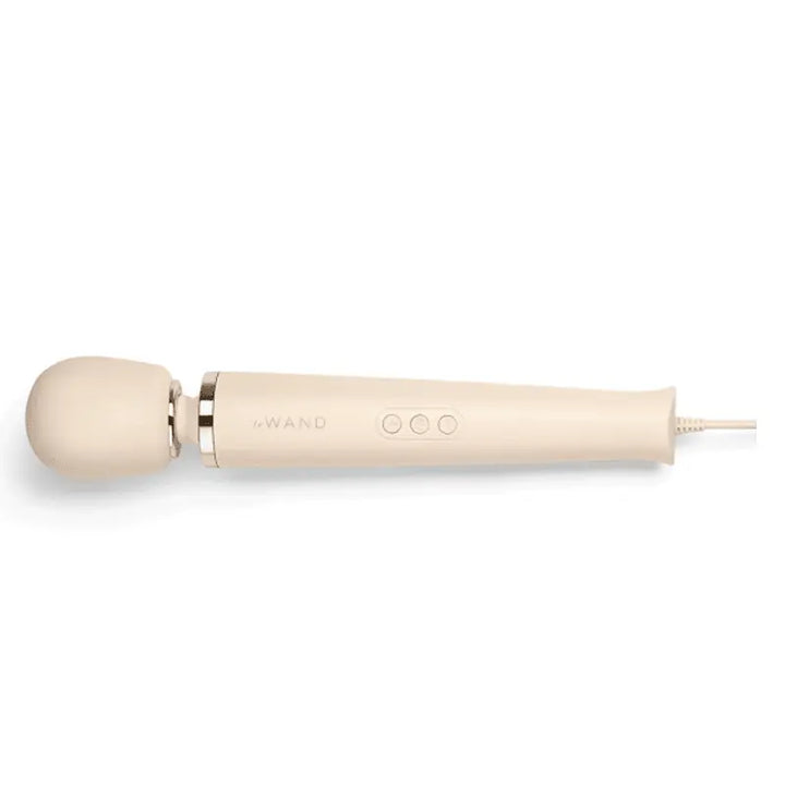 Le Wand Plug-In Vibrating Massager in cream with gold accent ring and control buttons
