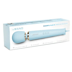 Le Wand Plug-In Vibrating Massager sky blue retail box showing product features and specifications