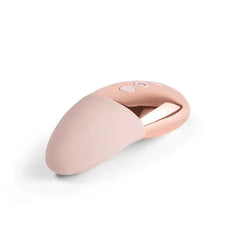 Le Wand Point blush pink silicone and rose gold massager shown from a side angle