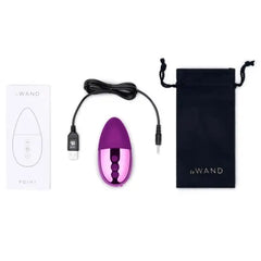 Le Wand Point complete set with USB charging cable, instruction booklet, and branded black drawstring pouch