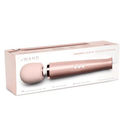 Le Wand Powerful Plug-In Vibrating Massager rose gold edition shown in its retail packaging box