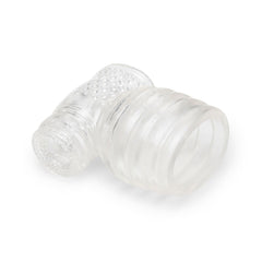Le Wand Slider lying flat, displaying both ribbed base opening and textured stimulation sleeve ends