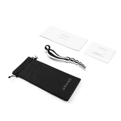 Le Wand Swerve with black pouch, instruction card, and care guide laid flat