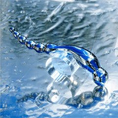 Le Wand Swerve stainless steel dildo shown submerged in water illustrating waterproof use