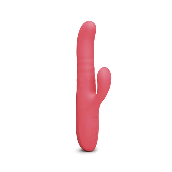 Le Wand Thrust rabbit vibrator in coral pink silicone, upright front view showing curved shaft