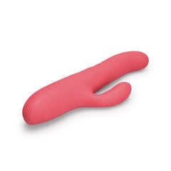 Le Wand Thrust rabbit vibrator lying flat, top-down angle showing dual-arm silhouette