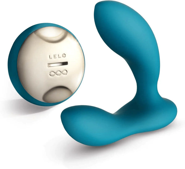LELO Hugo teal silicone prostate massager with rounded tip beside its oval wireless remote