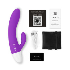 LELO KAYA Originals unboxed flat lay showing vibrator, USB cable, storage pouch, and app card