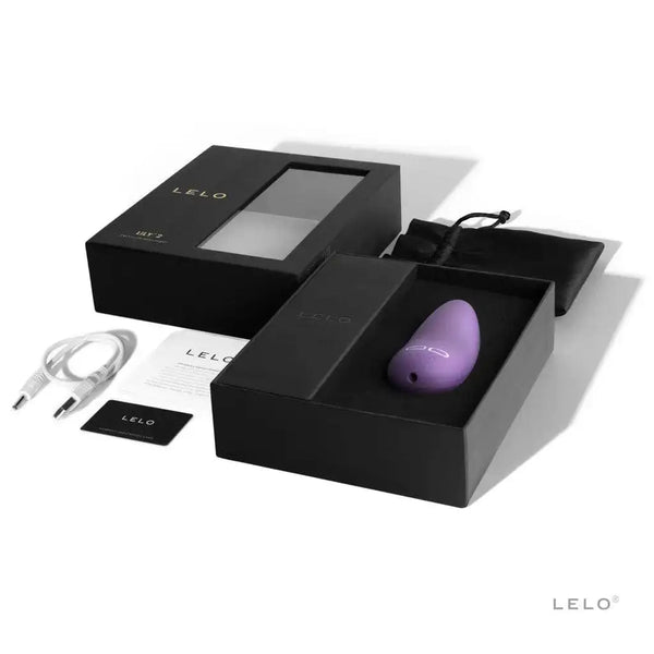 LELO Lily 2 lavender vibrator displayed with black gift box, charging cable, and pouch