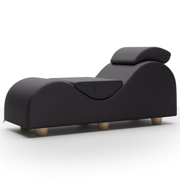 Liberator Esse II chaise lounge in black faux leather with curved body and wooden feet, front view