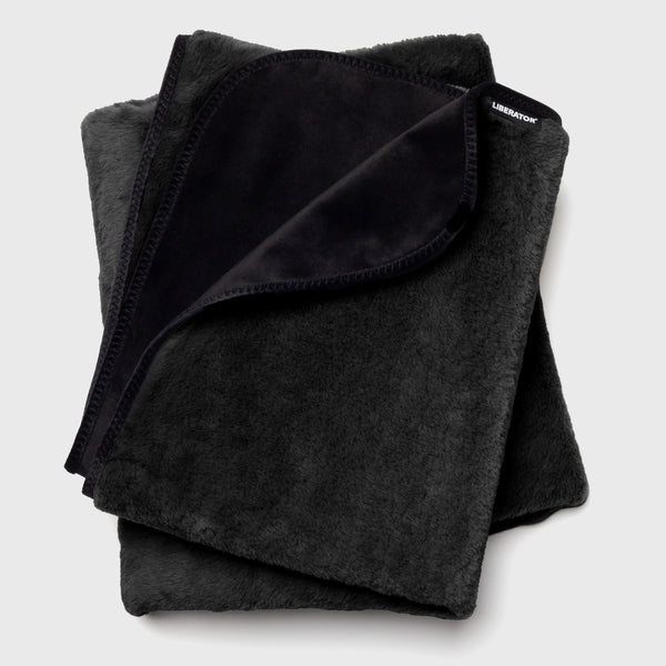 Liberator Fasinator Throw folded in black faux fur with velvet underside visible