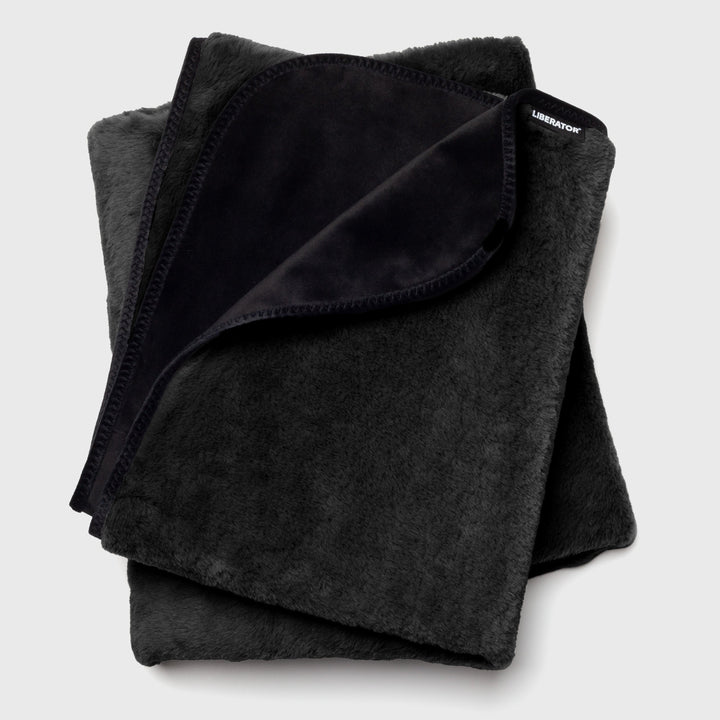 Liberator Fasinator Throw folded in black faux fur with velvet underside visible