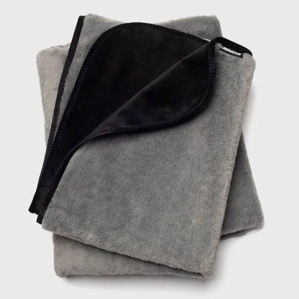 Liberator Fasinator Throw folded to reveal soft grey faux fur and sleek black velvet reverse side