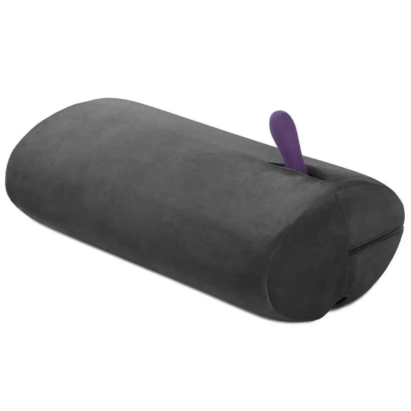 Liberator Wing Sex Toy Mount in black velvet with purple vibrator inserted in top slot