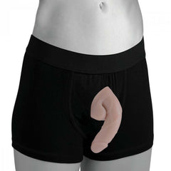 Light-tone packer dildo worn in black boxer briefs showing natural front profile
