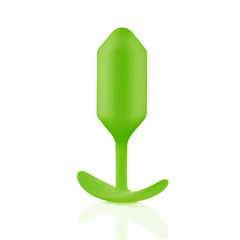 Close-up of lime green Snug Plug 3 smooth silicone surface and curved retrieval base