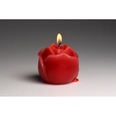 Lit Master Series red rose candle on gradient background showing wax pooling at the rounded base