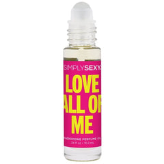 Close-up of Love All Of Me roll-on perfume oil applicator tip on clear glass bottle with pink label