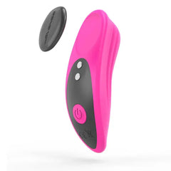 Lovense Ferri pink panty vibrator with magnetic charger disc detached, side angle