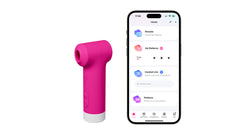 Lovense Fizz air-pulse vibrator beside a smartphone displaying the Lovense app control interface