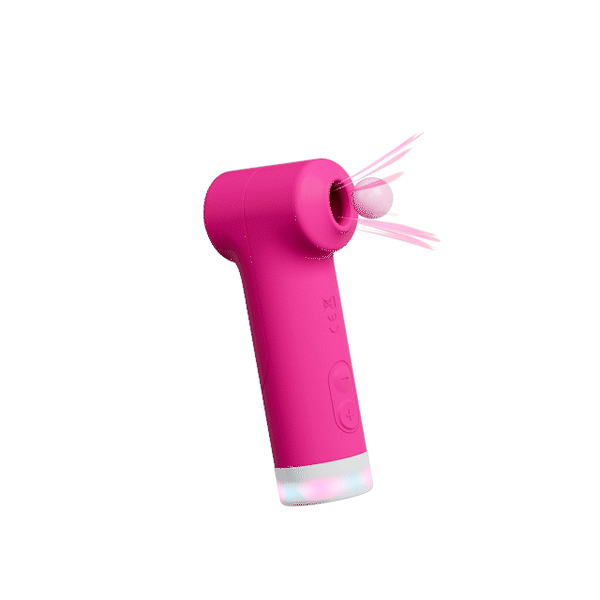 Lovense Fizz clitoral stimulator in magenta silicone shown at a dynamic angle with motion lines