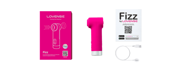 Lovense Fizz full contents laid out including device, pink retail box, quick-start guide, and USB cable