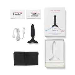 Lovense Hush 2 XS full contents laid out: plug, USB cable, storage bag, and manuals