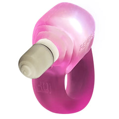 Low angle view of Glowdick cock ring showing LED bullet tip and semi-translucent pink body