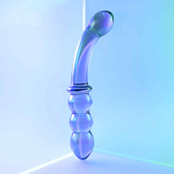 Lustrous Galaxy Wand standing upright in styled blue-lit setting showing full dual-ended silhouette