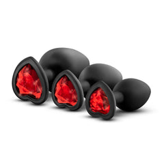 Luxe Bling Plugs set showing red heart-shaped gem bases on three graduated black silicone plugs