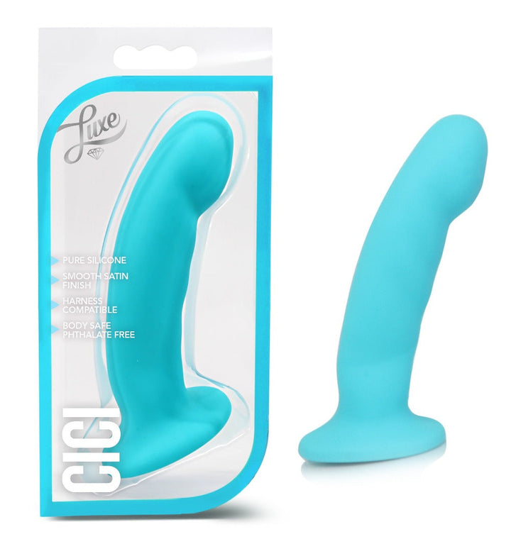 Luxe Cici blue silicone dildo with curved tip beside its retail packaging