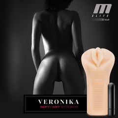 M Elite Veronika soft-wet stroker displayed beside included bullet vibe with branded lifestyle backdrop