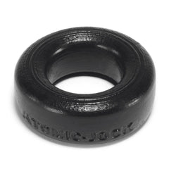 Macro view of black COCK-T ring base showing Atomic Jock embossed text and texture