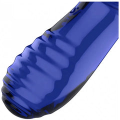 Macro close-up of grooved ribbed end of blue glass dildo showing defined texture pattern