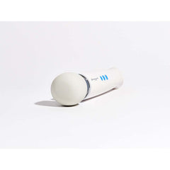Close-up of Magic Wand Mini soft silicone head resting on white surface, low angle view