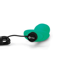 Magnetic USB charging cable attached to the base of the teal b-Vibe Twist plug