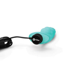 Magnetic USB charging cable connected to base of mint b-Vibe Bump silicone plug