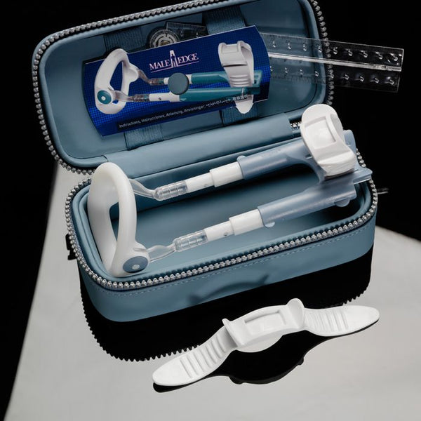 MaleEdge Basic penis enlarger device open in blue faux-leather zip case with ruler and strap