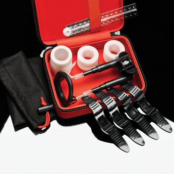 MaleEdge Pro penis enlarger kit open in red zip case with foam pads and extension rods