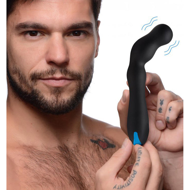 Man holding the 12X Silicone Beaded Prostate Vibrator with a blue charging port visible