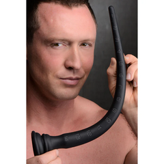 Close-up of man holding curved black silicone hose highlighting flexible tapered shape