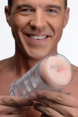 Man holding Jesse Jane signature stroker showing branded soft insert end