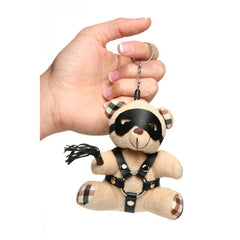 Master Series BDSM Teddy Bear Keychain held in hand, showing plaid accents and leather harness