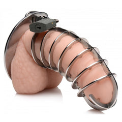 Master Series chastity cage fitted on model showing secure padlock closure at base