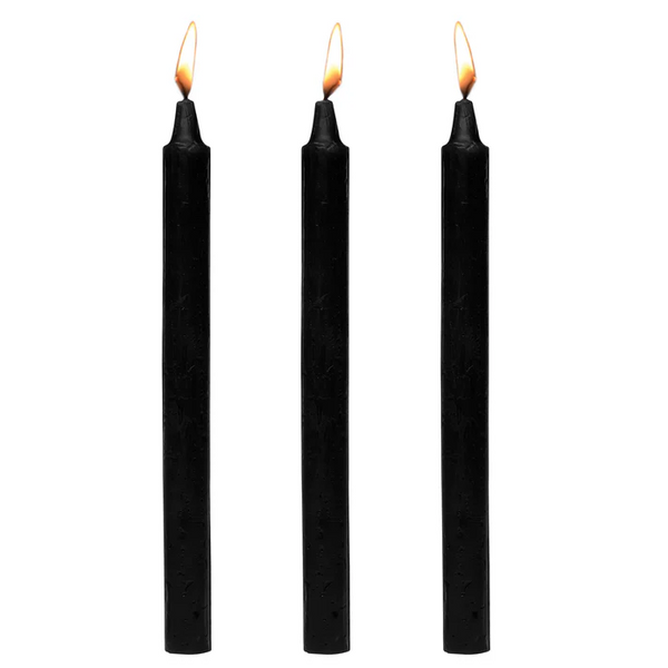 Master Series Dark Drippers black paraffin taper candles, set of three, lit flames