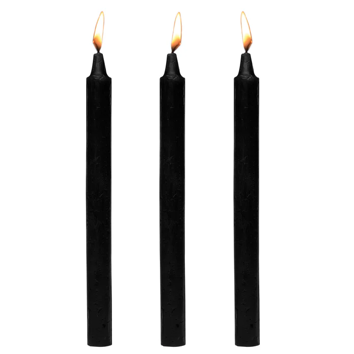 Master Series Dark Drippers black paraffin taper candles, set of three, lit flames