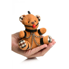 Master Series Gagged Bondage Teddy Bear Keychain held in palm, showing plaid ears and red ball gag
