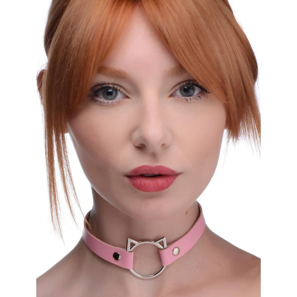 Master Series Kinky Kitty pink faux-leather choker with silver cat-ear ring, worn as a slim neckband