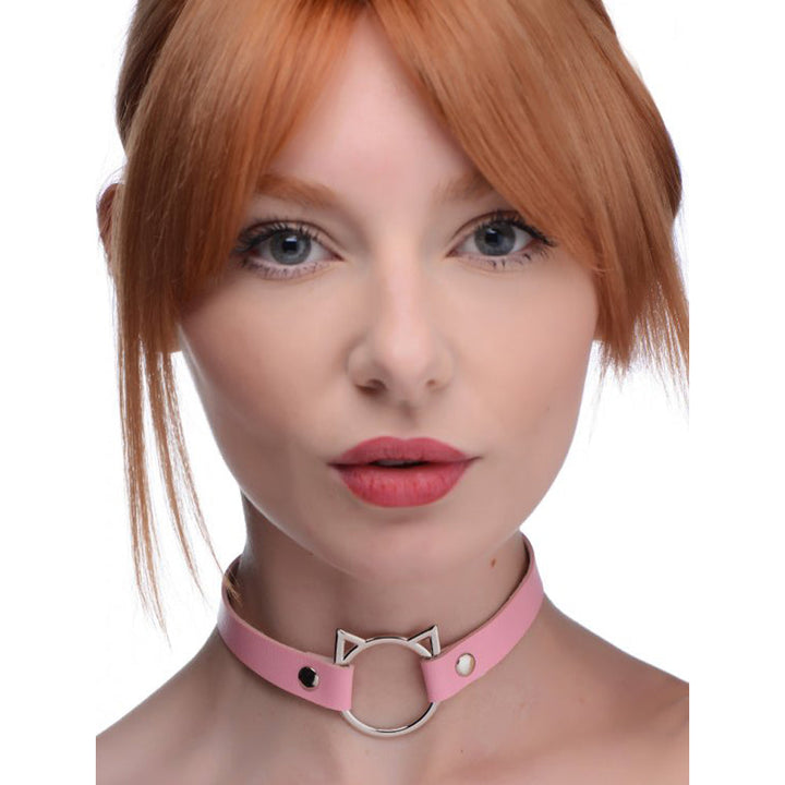 Master Series Kinky Kitty pink faux-leather choker with silver cat-ear ring, worn as a slim neckband